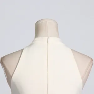 Close-up of the invisible back zipper on this elegant ivory French style sleeveless dress