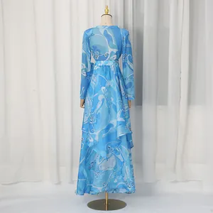 Detailed back view of a vintage blue printed irregular layered maxi dress on mannequin.
