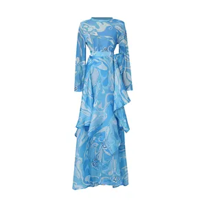 Detail of blue retro printed satin set with long sleeves and irregular skirt.