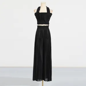 Elegant black two-piece pleated set featuring a halter flounce top and high-waist wide-leg pants