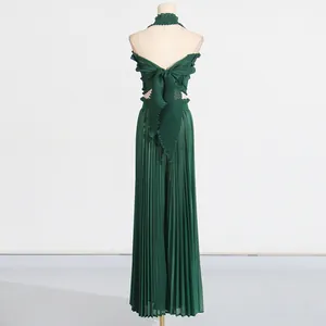 Back view detail of green pleated two-piece set with halter ruffle top and pants