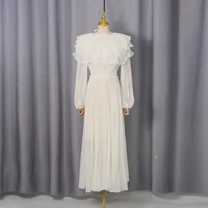 Full view of elegant white palace style pleated chiffon dress with ruffled collar
