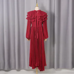 Detailed back view of a red pleated palace style dress with lantern sleeves and ruffles