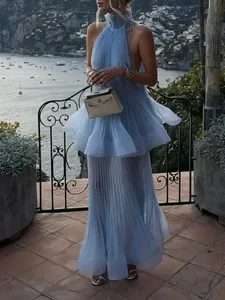 Elegant blue pleated halter neck maxi dress with ruffled layers for summer resort style