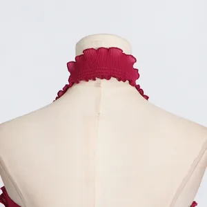 Detail view of burgundy pleated halter neck top with elegant ruffle trim on a mannequin