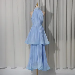 Elegant light blue pleated halter sleeveless tiered maxi dress for summer vacations.