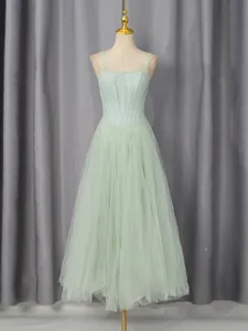 Elegant light green embroidered strap maxi dress with mesh layering for bridesmaids.