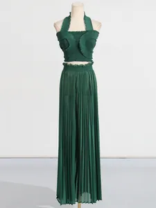 Dark green two-piece pleated set featuring a ruffled halter top and wide-leg pants