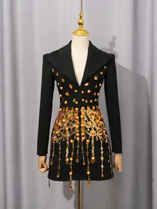 Luxury black blazer dress with gold sequin fringe and intricate amber gem embellishments