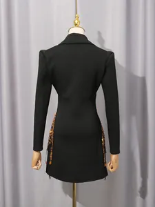 Back view of elegant black blazer dress with gold sequin fringe and vintage court style