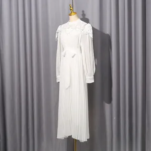 Elegant white chiffon maxi dress featuring delicate lace neck detail and a pleated skirt