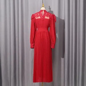 Close-up detail of elegant red long-sleeved pleated chiffon maxi dress featuring lace back