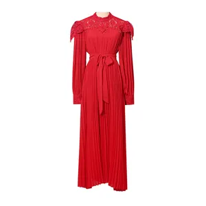 Elegant red pleated maxi dress featuring intricate lace detailing and a flattering waist tie