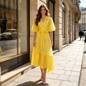 Full body view of an elegant yellow lace maxi dress with puff sleeves and belted waist