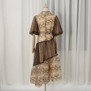 Elegant back view of snake print lace holiday dress with puff sleeves on a mannequin