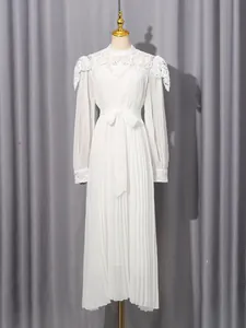Elegant white chiffon maxi dress with lace stand collar and pleated skirt on mannequin.
