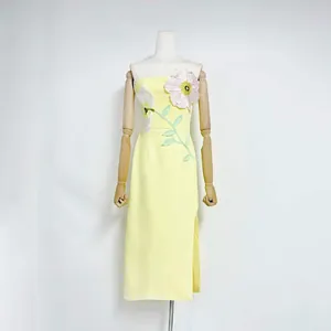 Elegant yellow strapless midi dress with 3D floral embroidery and side slit detail