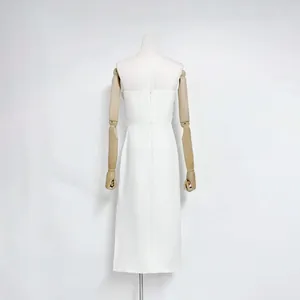 Detailed back view of a white strapless midi dress with refined back zipper detail.