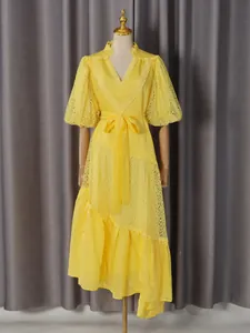 French style yellow lace vacation dress with V-neck puff sleeves and belted waist.