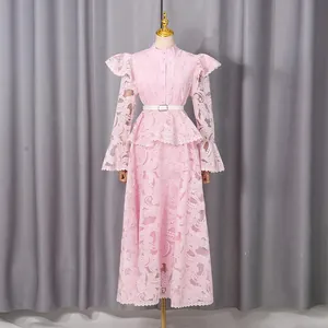 Elegant pink lace embroidered maxi dress with flare sleeves and ruffles on mannequin
