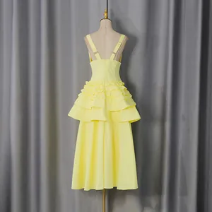 Back view detail of elegant yellow French retro ruffled tiered midi dress for women