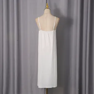 Detailed back view of a white full-length adjustable strap camisole slip dress for women