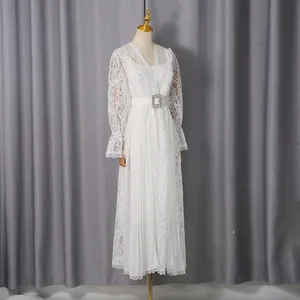 Elegant white lace long-sleeved maxi dress with waist belt detail and pleated skirt