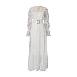 Elegant white hollow-out lace maxi dress with crystal buckle belt and pleated skirt detail