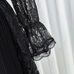 Close-up macro detail of elegant black hollow lace sleeve on retro court style dress