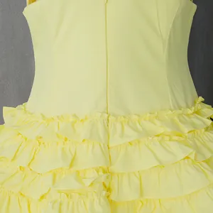 Close-up of yellow tiered ruffle skirt detail on a vintage French midi dress.