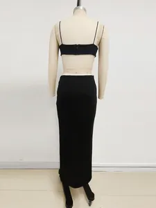 Elegante set nero due pezzi con top a canotta cropped e gonna lunga a tubino aderente