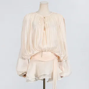 Elegant cream pleated mini dress with a bow neck and tiered ruffle hem