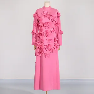 Full view of pink long sleeve maxi dress featuring intricate 3D floral appliqués