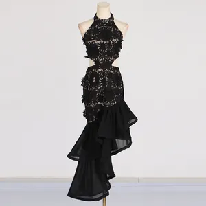 Detailed view of elegant black lace halter dress with waist cut-outs and ruffled hem