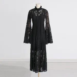 Detailed view of an elegant French style black lace maxi dress with delicate embroidery