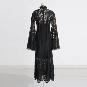 Back view of elegant black lace dress with flared sleeves and high collar