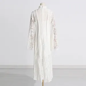 Back view detail of elegant white lace long dress with intricate floral embroidery