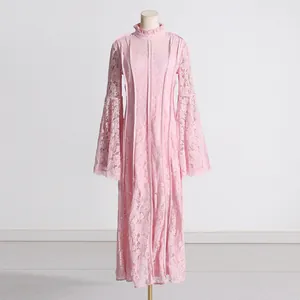 High-quality detail shot of elegant pink French style lace dress with vintage bell sleeves
