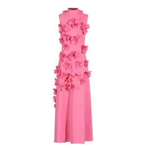 Detailed view of the elegant pink maxi dress with intricate 3D flower applique and stand collar