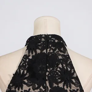 Detailed view of high-neck black floral lace embroidery on a sleeveless summer dress