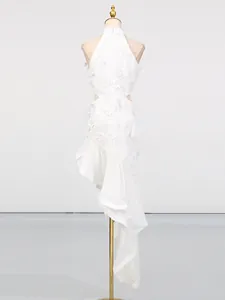 Elegant white high-neck sleeveless dress with cutout waist and asymmetrical ruffle hem