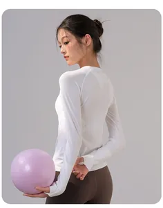 Detail view showing the back profile of a breathable long-sleeve white yoga top for Pilates.