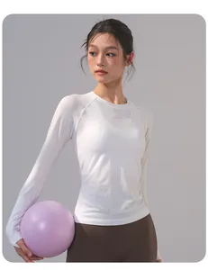Detail view of breathable white long-sleeved yoga top with textured mesh fabric design