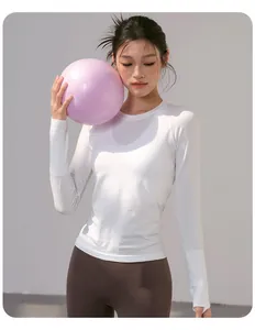 Close-up of white breathable long-sleeved yoga top with thumbholes on Asian model