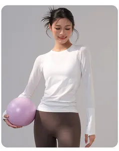 Slim fit white long sleeve yoga top for women, breathable sports wear for Pilates training