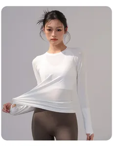 Detail view of a white slim-fit long-sleeve yoga top showing high elasticity
