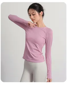 View of the pink slim-fit yoga long sleeve top showing the neckline and sleeve detail