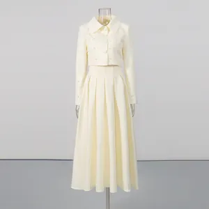 Full view of elegant cream two-piece set displayed on a mannequin in a studio setting