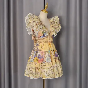 Detail view of a French style floral mini dress with flutter sleeves and V-neck