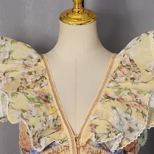 Detailed view of an elegant floral print V-neck dress with ruffled butterfly sleeves and lace